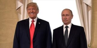 Дональд Трамп і Володимир Путін під час минулої зустрічі на міжнародному форумі.