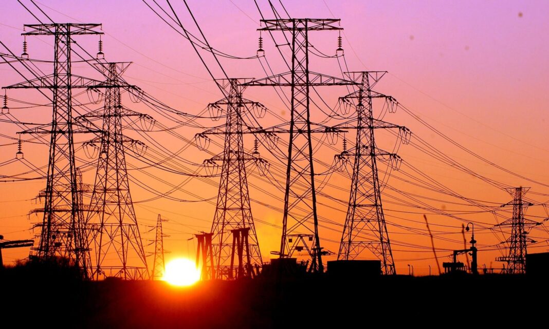 Power lines at sunset after the shelling of energy infrastructure.