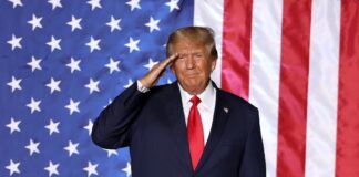 Donald Trump on the background of the flag