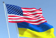 Flags of Ukraine and the United States during international negotiations