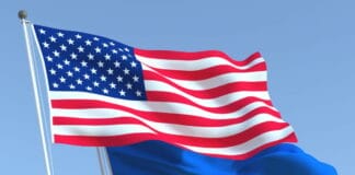 Прапори України та США під час міжнародних перемовин