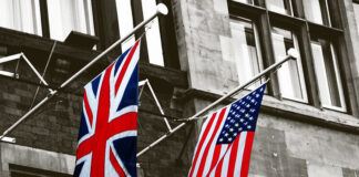 The flags of the United Kingdom and the United States against the background of the intelligence headquarters