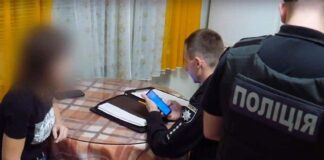 A police officer draws up an urgent restraining order on a service tablet