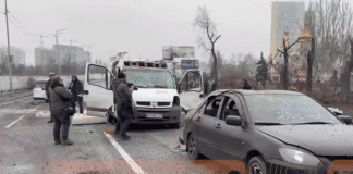 Damaged cars on the streets of Kyiv after rocket fragments fell