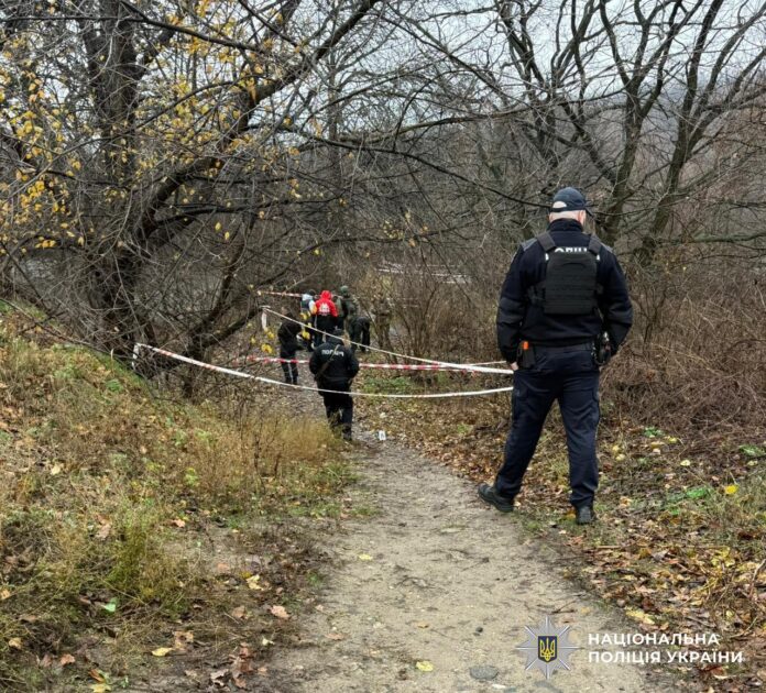 Police officers and bomb squad work at the scene of a terrorist attack in Dnipro