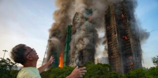 Large-scale fire engulfs several high-rise buildings in a Hong Kong residential complex