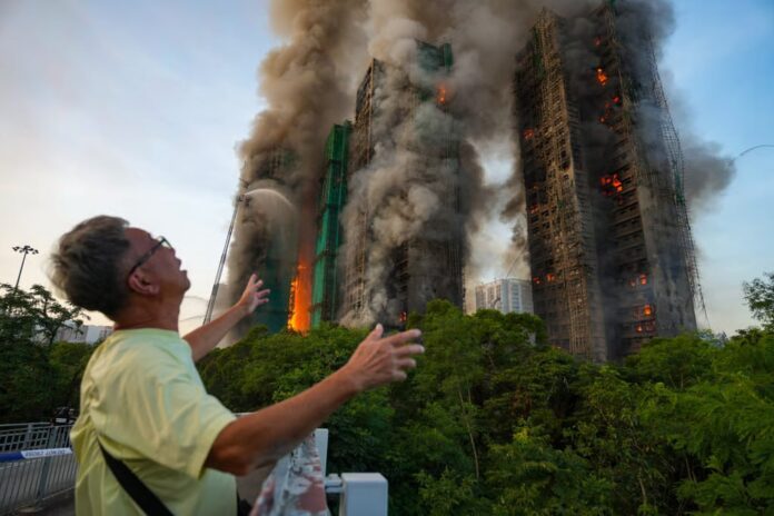 Large-scale fire engulfs several high-rise buildings in a Hong Kong residential complex