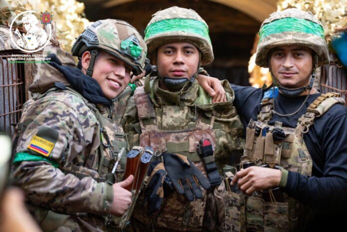 Colombian soldiers in a dugout in the Zaporizhzhia sector with Ukrainian defenders
