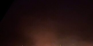 Nighttime smoke column over the village of Dragunske after an explosion at a substation