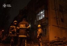 SES rescuers work near damaged house in Odesa after drone attack