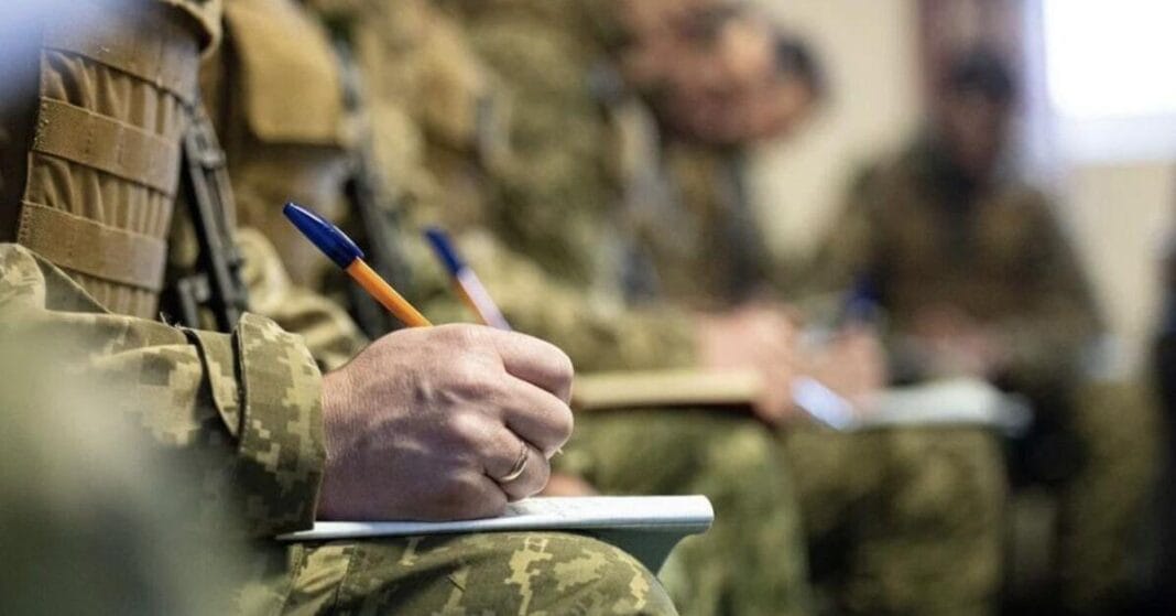 A serviceman of the Armed Forces of Ukraine signs a service contract