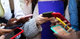 Children with mobile phones in their hands