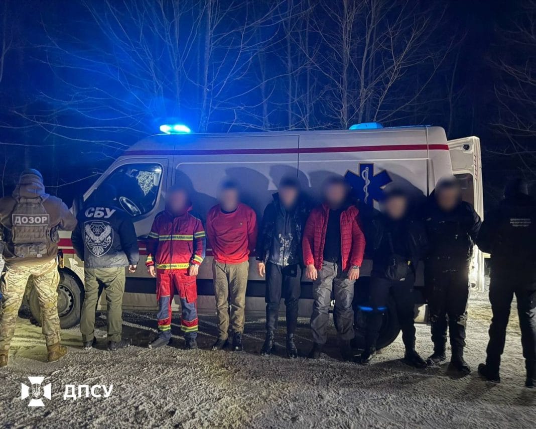 photo_2026-02-25_17-48-10 Detained men near an ambulance at the border