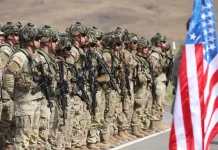 US troops leave a base in the Middle East.