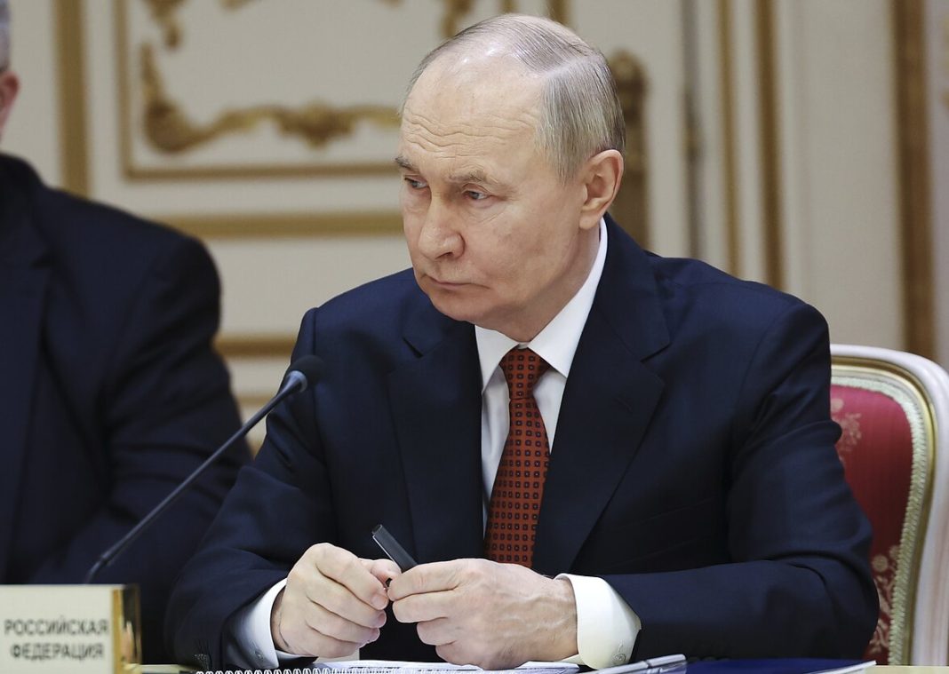 Vladimir Putin during a meeting with officials in the Kremlin