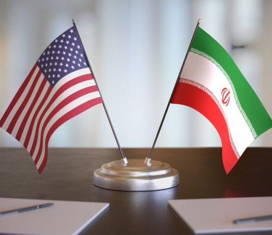 THE US AND IRAN PREPARE A MEETING IN PAKISTAN Flags of Iran and the United States