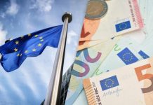 Ukraine faces a shortfall in war funding EU flag and euro banknotes