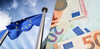 Ukraine faces a shortfall in war funding EU flag and euro banknotes