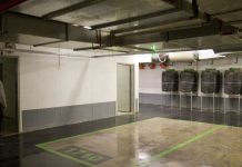 a modern residential building with an entrance shelter