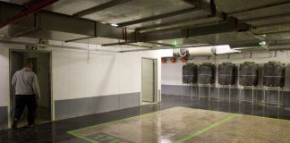 a modern residential building with an entrance shelter