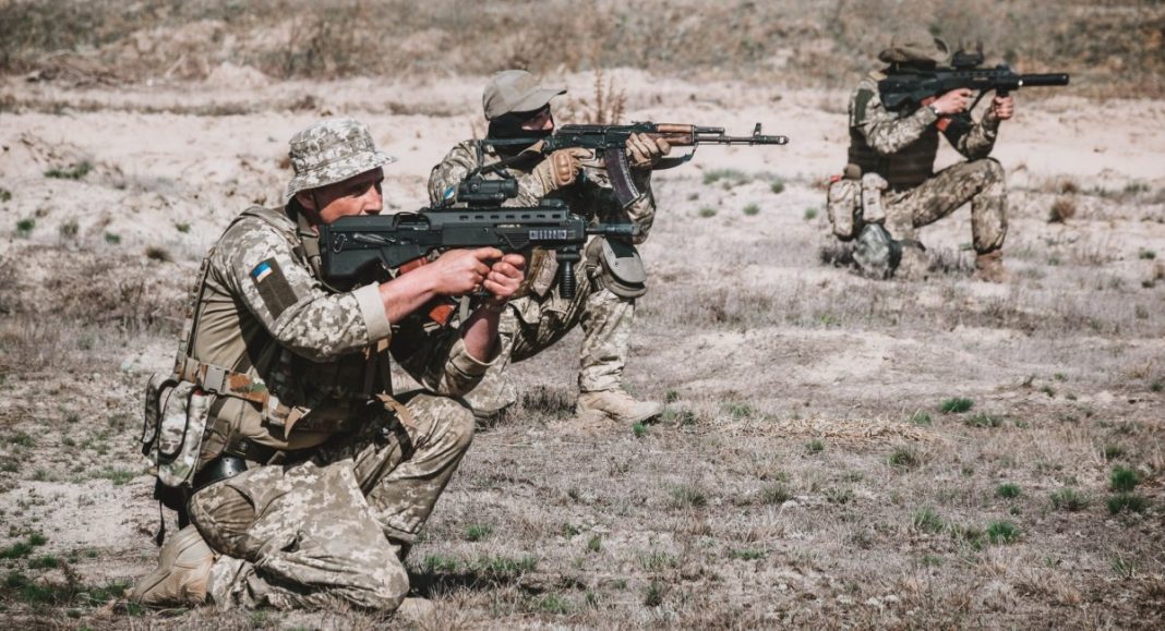 Military personnel at a training ground during training