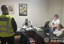 Law enforcement officers conduct a search in a medical facility