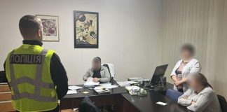 Law enforcement officers conduct a search in a medical facility