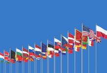 NATO flags against the backdrop of the Alliance's headquarters