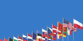 NATO flags against the backdrop of the Alliance's headquarters