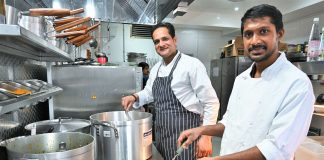 cook in the kitchen of a restaurant in India