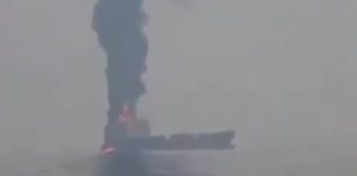 Smoke over a ship after an incident at sea
