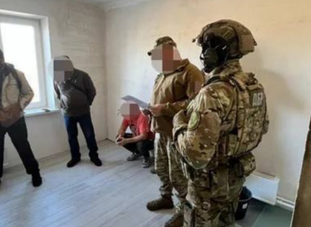 A house being repaired by military personnel