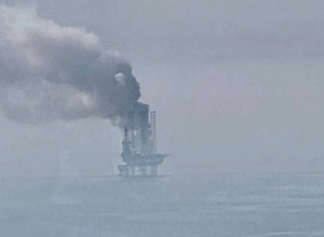 Smoke over the offshore oil platform after the attack