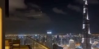 A view of the air defence system against the backdrop of the city of Dubai in the evening