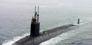 The Astute-class nuclear-powered submarine HMS Anson on the water.