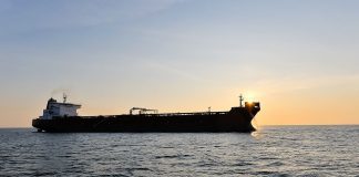 IRAN WANTS TO CHARGE $2M FOR TANKER PASSAGE A tanker passes through the Strait of Hormuz against the backdrop of the Iranian coast