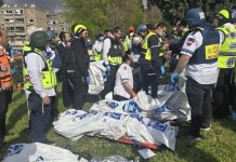 Iranian missile attack on Israel claims 8 lives Rescuers work at the site of a rocket attack in Israel