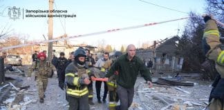 Rescuers work near damaged buildings in Zaporizhzhia