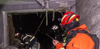 Rescuers work near damaged high-rise building in Kharkiv after drone strike