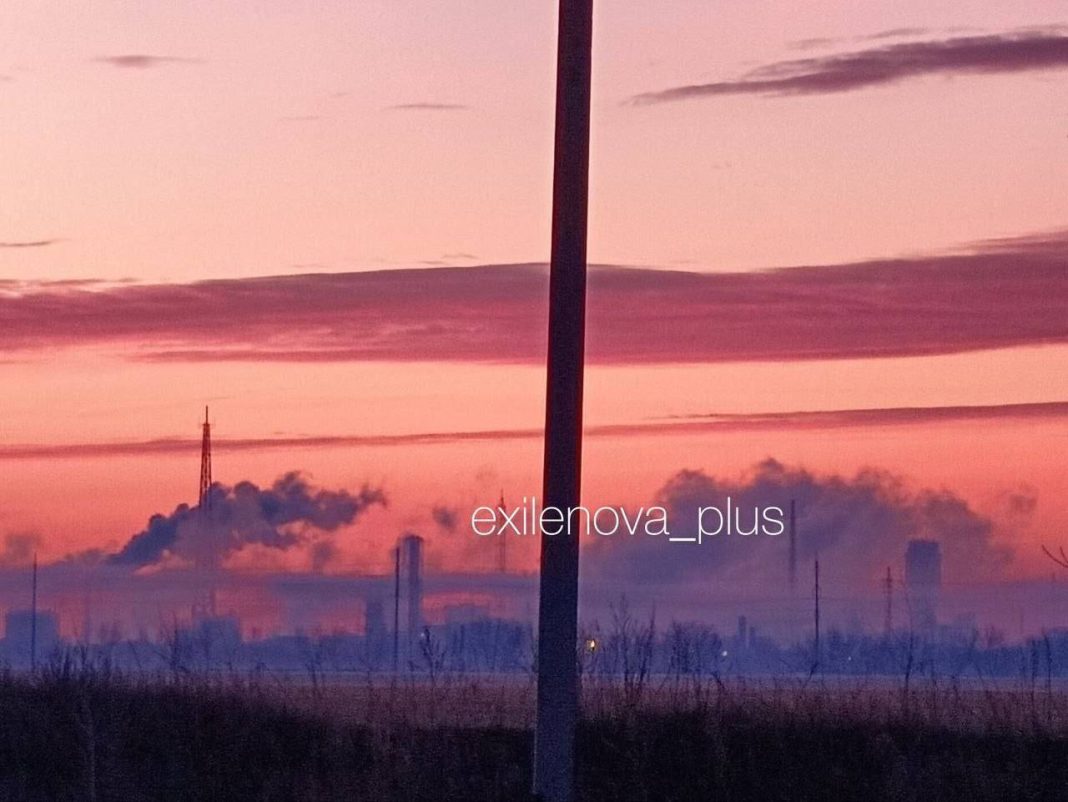 photo_2026-03-30_07-32-47 Night panorama of an industrial plant with smoke after an explosion