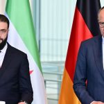 Merz plans to return 80% Syrians home Friedrich Merz speaks to the press against the backdrop of the German flag