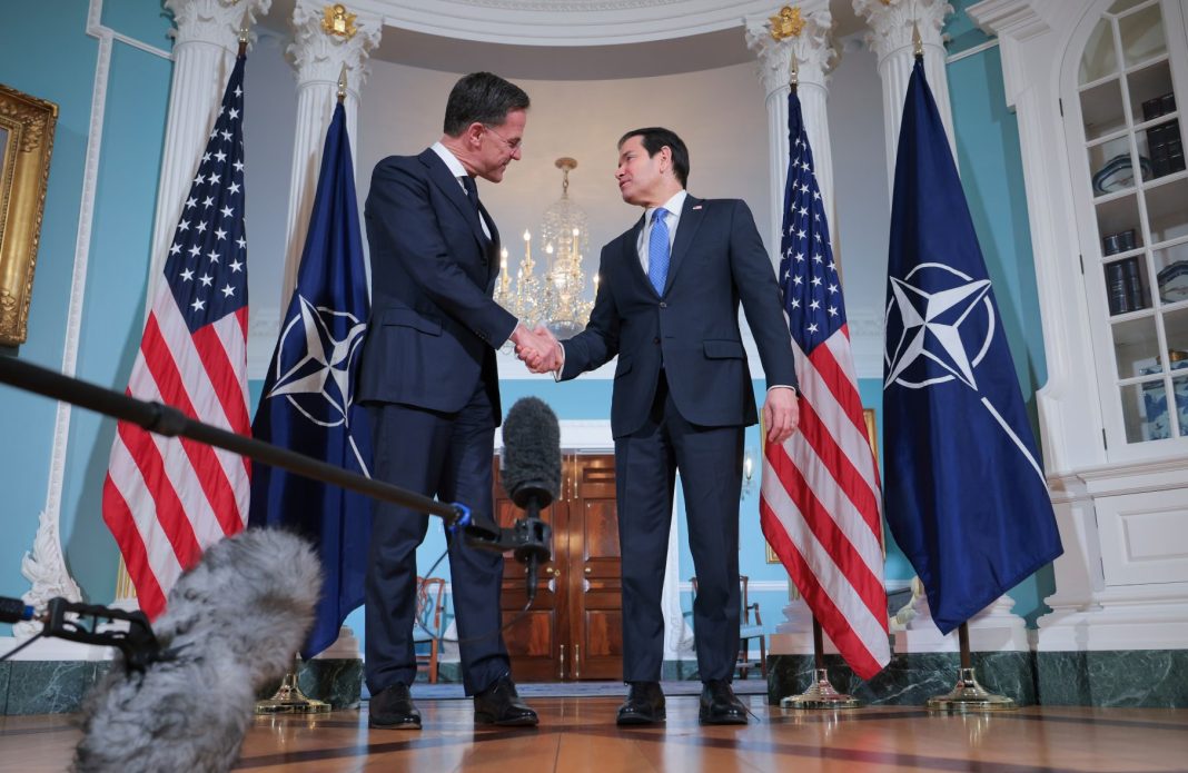 Marco Rubio and Rutte against the backdrop of NATO flags