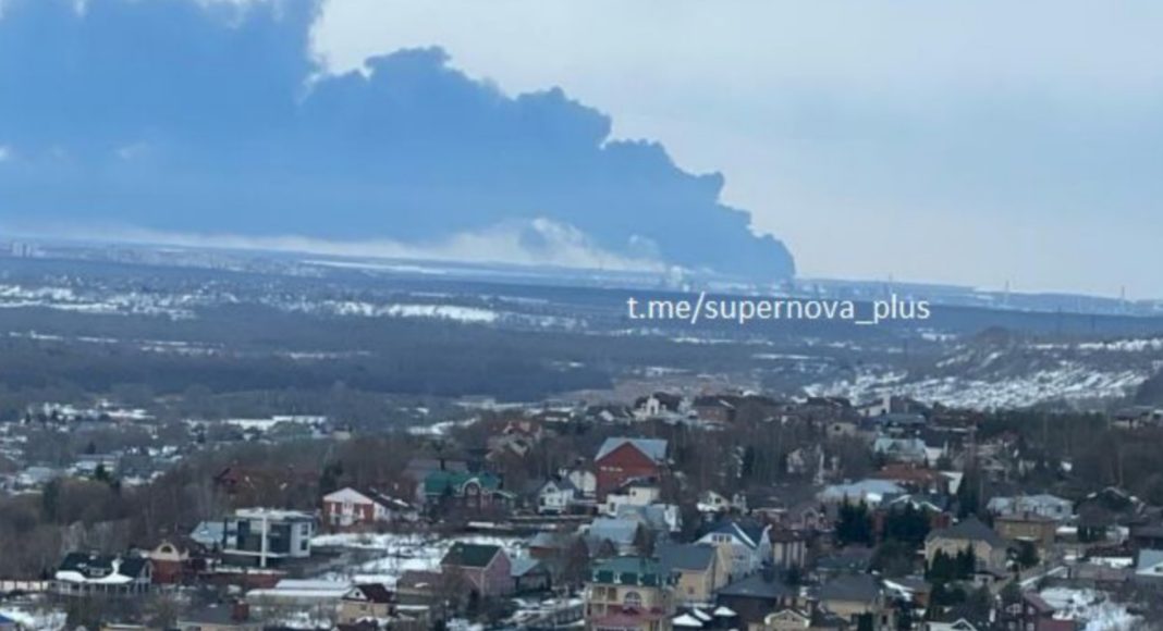 Smoke over an oil refinery