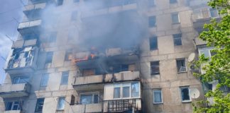 Firefighters near a high-rise building after the attack