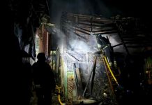 Rescuers extinguish fire after shelling