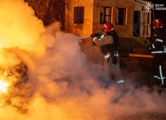 Rescuers extinguish fire after attack