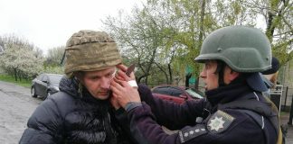 Police officers at the site of the explosion in Mykolaivka