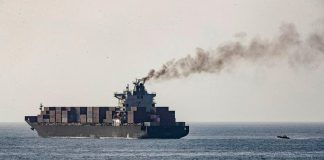 Iranian tanker at sea, escorting a warship