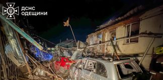 Rescuers near a destroyed building in Odesa