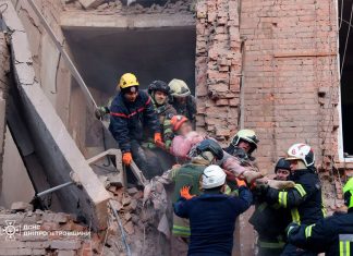 Rescuers clear rubble after Russian attack in Dnipro